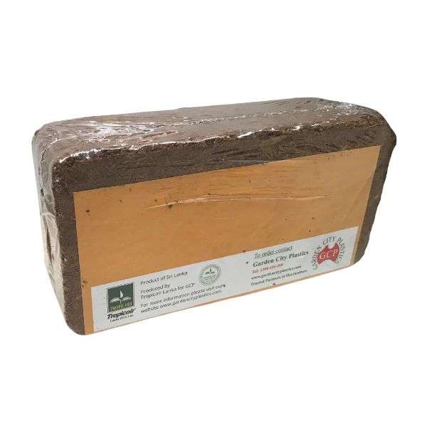 ryset-tropicoir-coir-block-qualitygardensupplies-03 - Quality Garden Supplies Rectangular compressed block of soil or peat with a printed label on the front edge. - Quality Garden Supplies